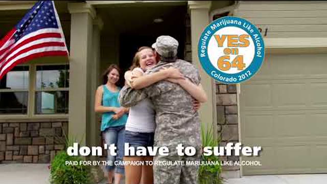 Still from the ad: a soldier home with his family, and the words don’t have to suffer